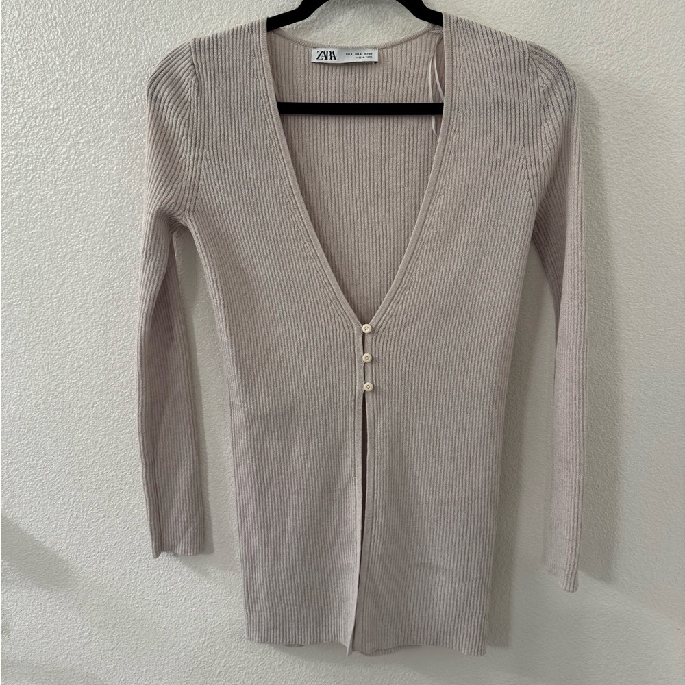 Zara baby pink low cut shirt. Can be worn as cardigan. Size small. Never worn.